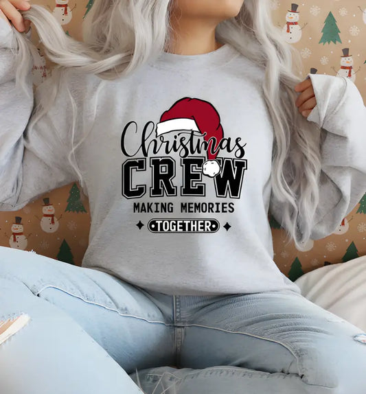 White sweatshirt with ’Christmas Crew Making Memories Together’ text and Santa hat graphic.