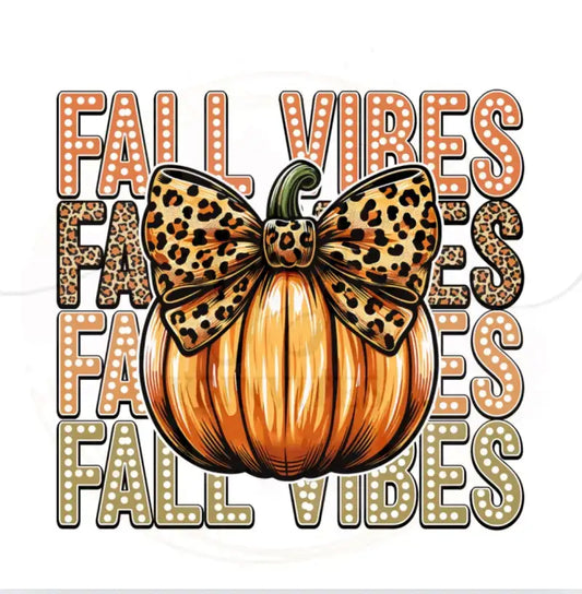 Orange pumpkin decorated with a leopard print bow and surrounded by repeating ’FALL VIBES’ text.