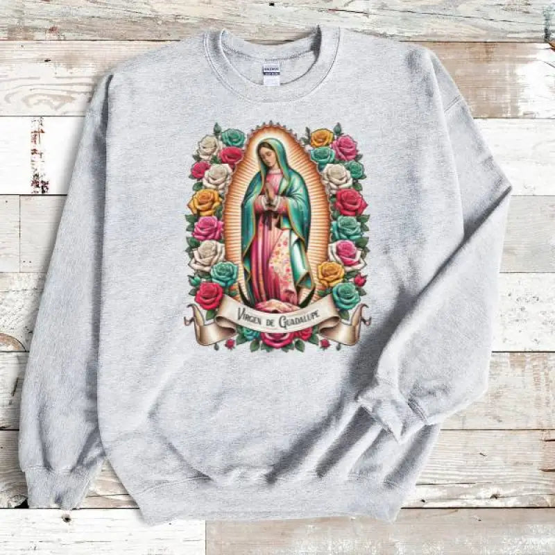 Gray sweatshirt featuring the Virgin of Guadalupe surrounded by colorful roses.