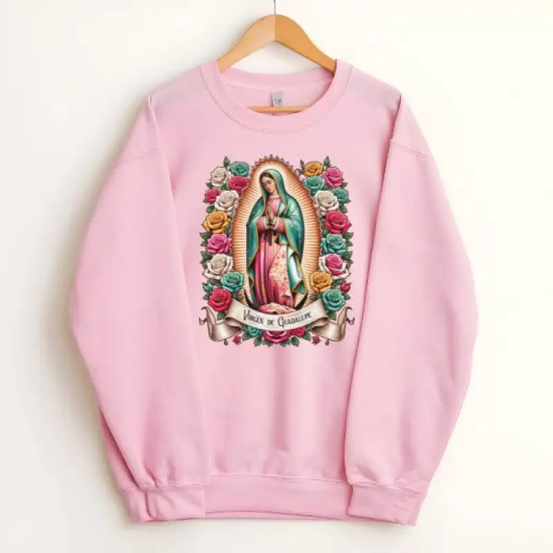 Pink sweatshirt featuring the Virgin of Guadalupe surrounded by colorful roses.