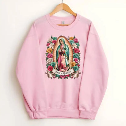 Pink sweatshirt featuring the Virgin of Guadalupe surrounded by colorful roses.